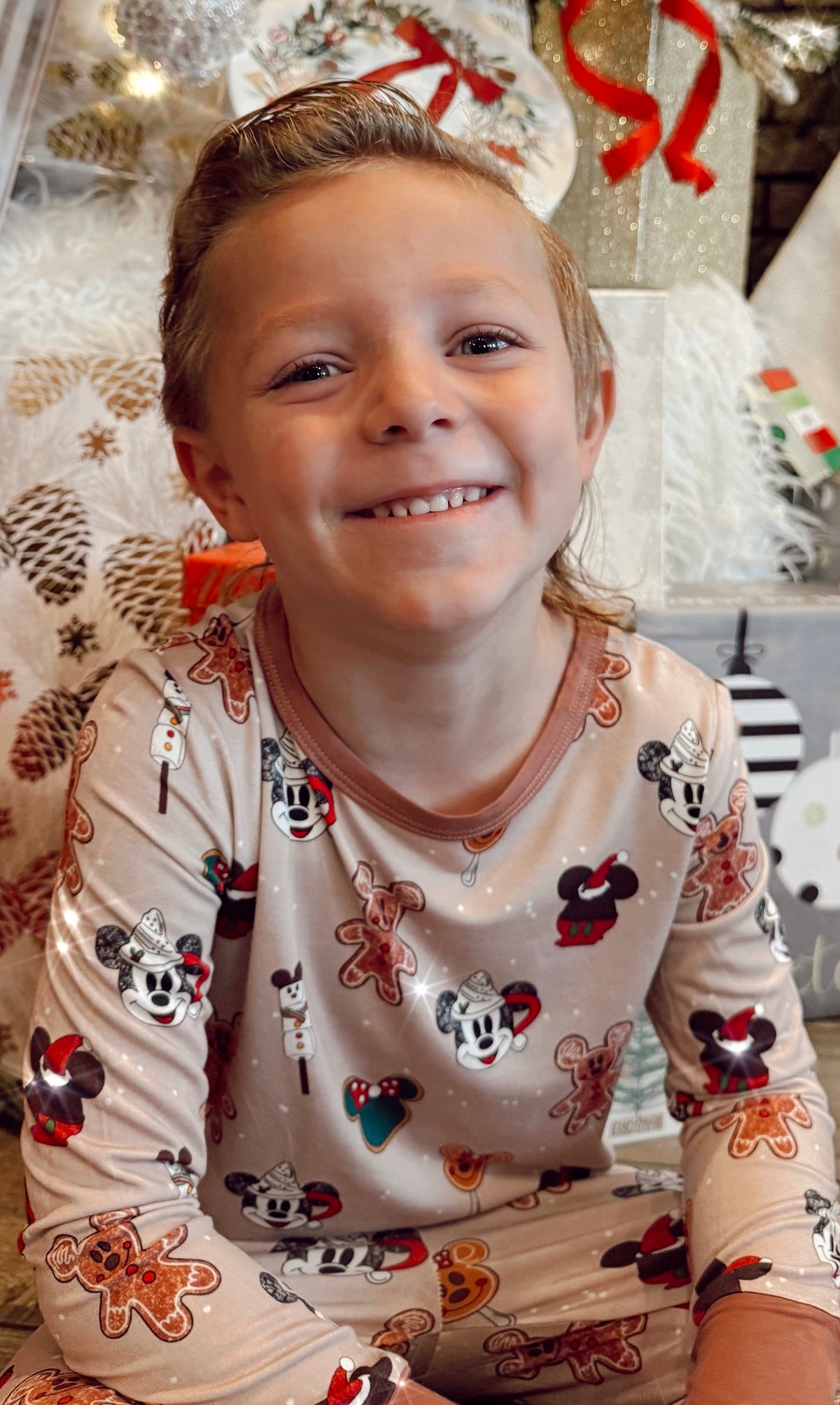 Smiling boy wearing Magical Christmas Morning kids bamboo Christmas pajamas
